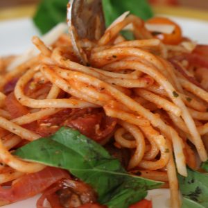 Fork with Spaghetti with fire roasted crushed tomato sauce