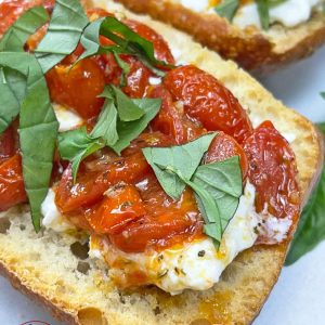 Toasted-bread-topped-with-creamy-burrata-cheese-and-a-flavorful-roasted-tomatoes-and-garlic-combo-that-will-leave-you-asking-for-more.