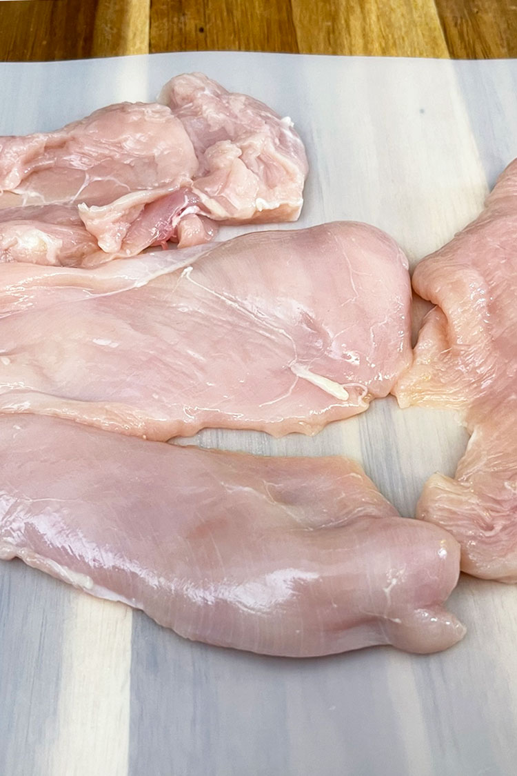 - Prepare the chicken: Place your hand on top of each chicken breast and carefully slice each breast in half, lengthwise.ย Make sure to trim any excess fat from the chicken. Chicken-Breast