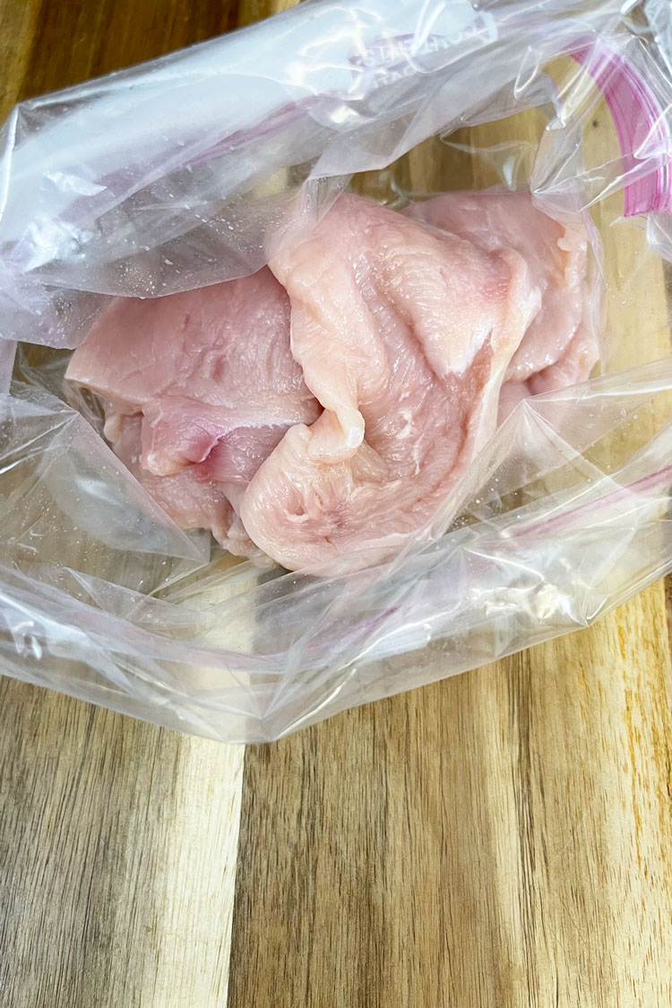 Place the chicken in a mixing bowl or a ziplock bag for easy cleanup. Place the chicken in a mixing bowl or a ziplock bag for easy cleanup.