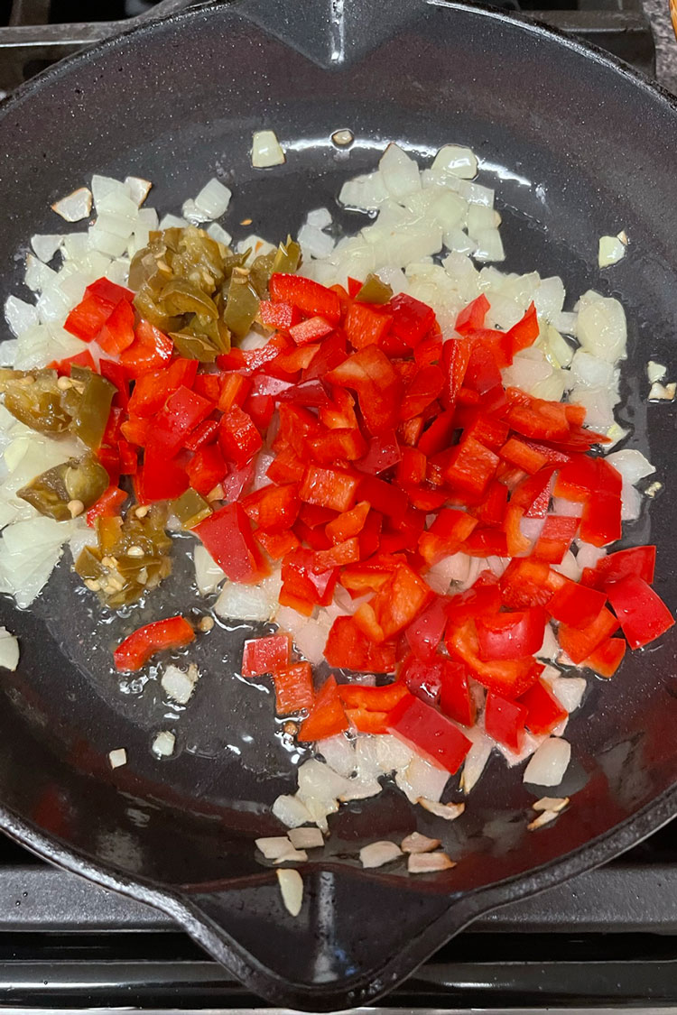 Then, add the bell pepper and continue cooking. Stir occasionally until the vegetables are very tender and lightly browned. This should take about 12 to 15 minutes. Then,-add-the-bell-pepper-and-continue-cooking.-Stir-occasionally-until-the-vegetables-are-very-tender-and-lightly-browned.