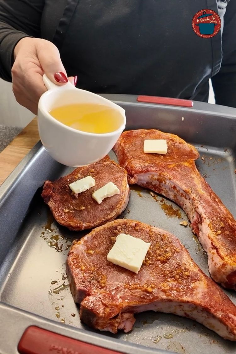 Put the pork chops in a baking dish and add minced garlic and unsalted butter. Pour in white wine, or if you prefer, substitute with vegetable stock or water. Pork Chops