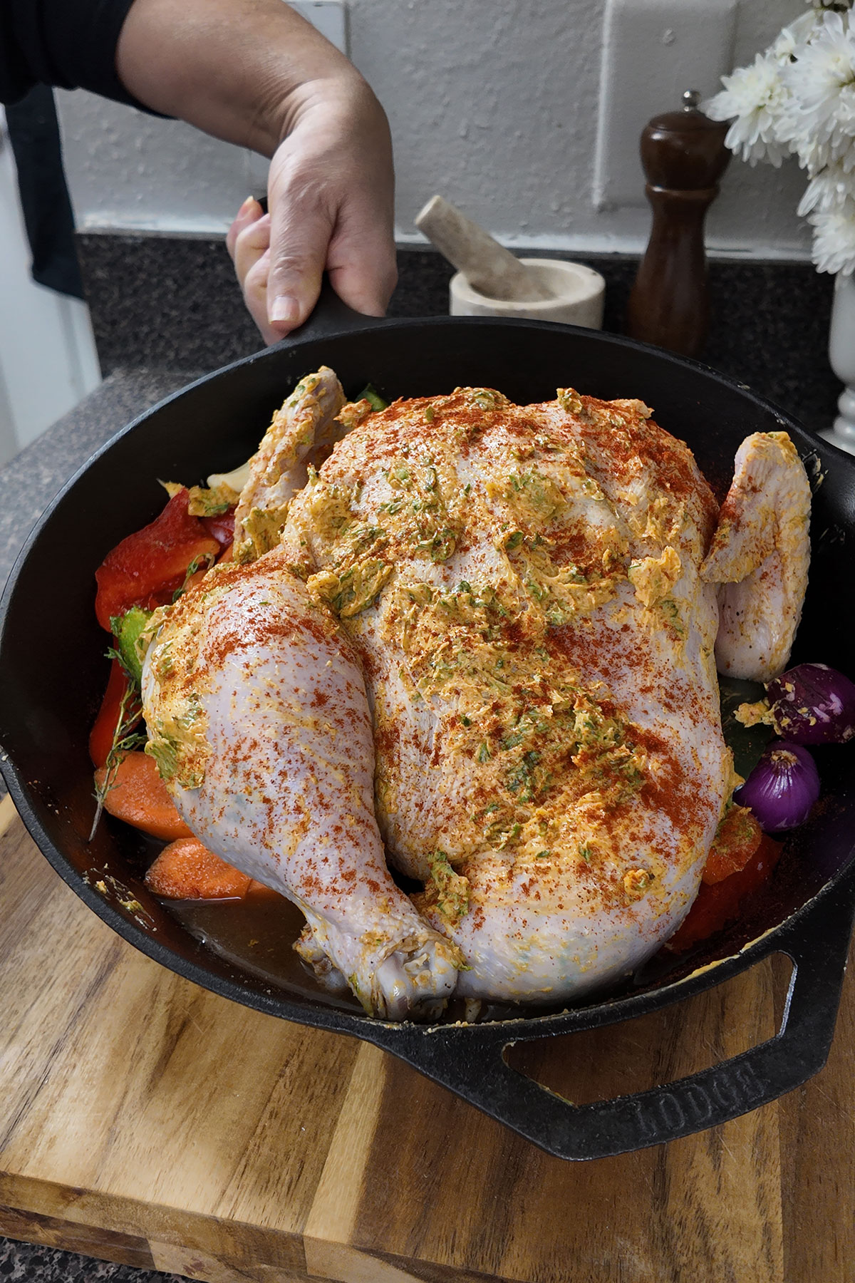 Spread-the-butter-mixture-over-the-chicken-and-stuff-its-cavity.