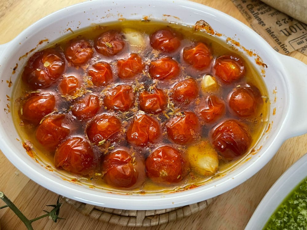 The first one is the delicious cherry tomato confetti.ย Preheat the oven to 350ยฐF.ย In an oven-safe dish, combine the garlic cloves, cherry tomatoes, rosemary (optional), olive oil, salt, and pepper. Bake for 30โ40 minutes, until the tomatoes are soft. Cherry-Tomato-Confit