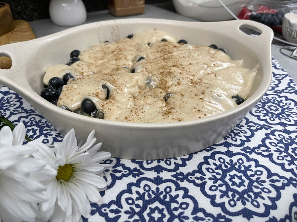 The batter is spooned over the blueberry mixture before baking, and as it cooks, it puffs up around the fruit, creating a beautiful and delicious crust. Easy-Cobbler-Recipe