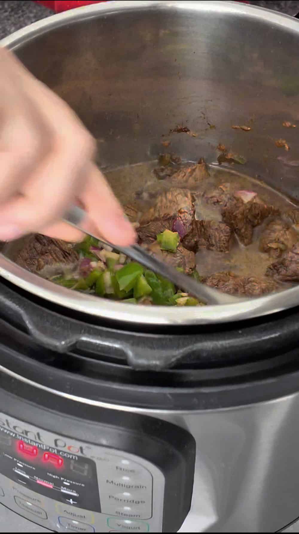 After 20 minutes of cooking, carefully release the steam from the pressure cooker and then it's safe to open the lid. The meat should now be tender. After 20 minutes of cooking, carefully release the steam from the pressure cooker and then it's safe to open the lid. The meat should now be tender.