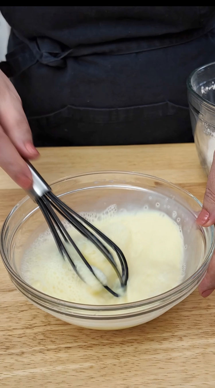 Whisk the egg and buttermilk together until they are just combined. Over-whisking can incorporate too much air and affect the texture. Add-a-large-egg-to-the-buttermilk-and-lightly-whisk