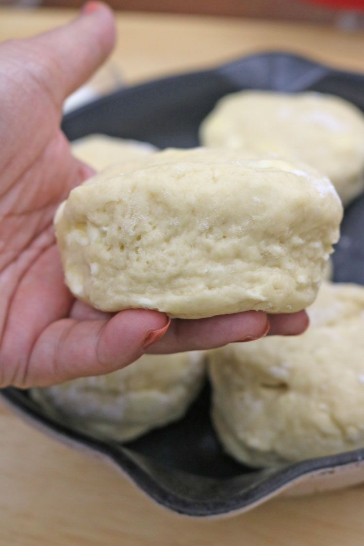 Dip a biscuit cutter in flour and cut the dough. Do not twist the cutter; push straight down. Re-roll scraps and repeat. Easy-homemade-biscuits