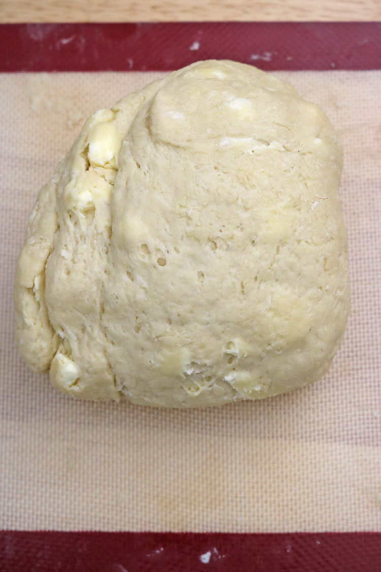 I use the baking mat as well to make things practical. Pat the dough to make a smooth top, and roll it gently to about 1 1/4 inches thick. I use the baking mat as well to make things practical. Pat the dough to make a smooth top, and roll it gently to about 1 1/4 inches thick.