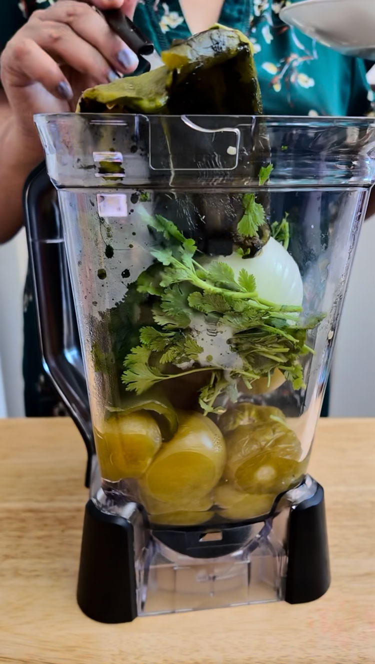 In a blender, add the tomatillos, roasted poblano peppers, serranos, onion, garlic, and cilantro. Pour in the chicken broth and blend until smooth. In-a-blender,-add-the-tomatillos,-roasted-poblano-peppers,-serranos,-onion,-garlic,-and-cilantro.
