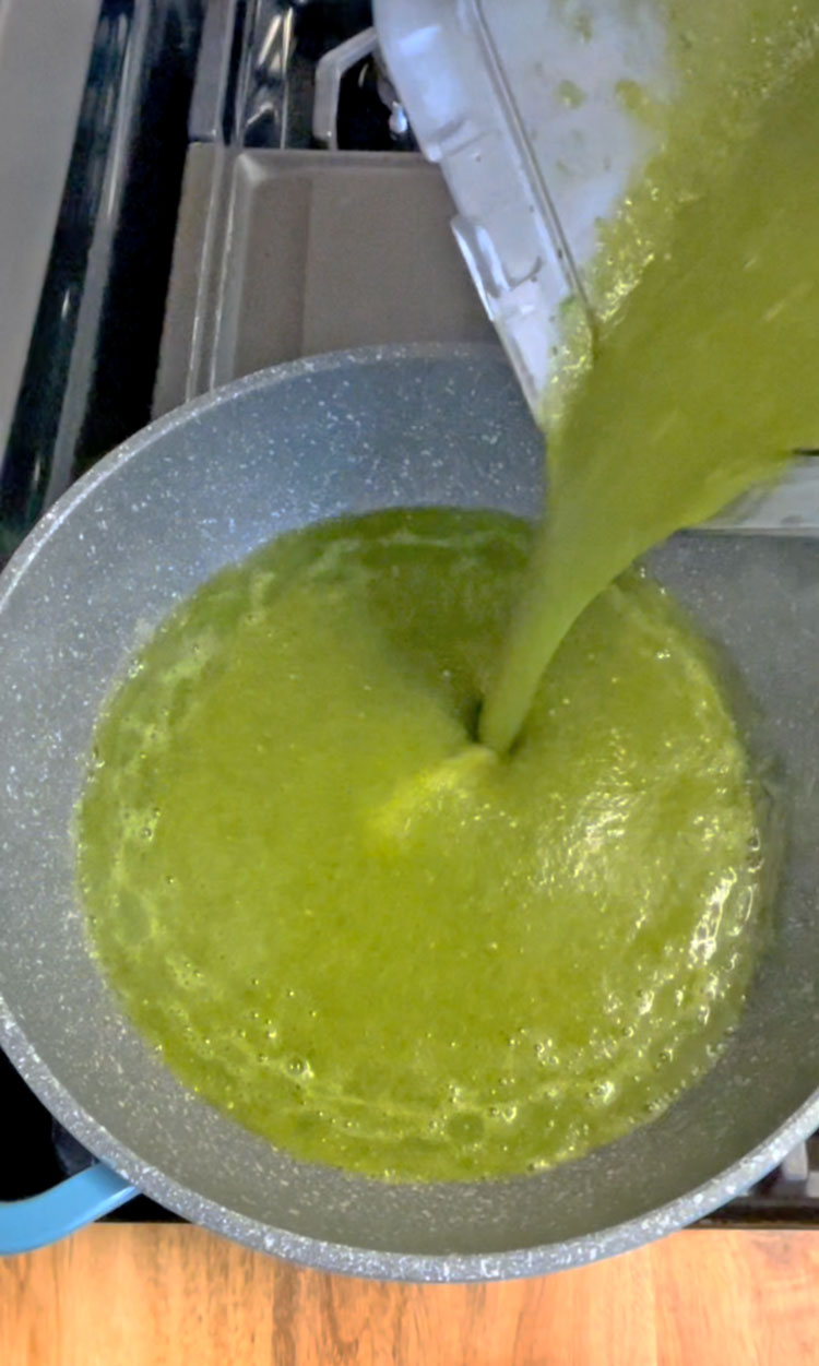 In a saucepan over medium-high heat, warm the oil until it is smoking. Quickly add the tomatillo sauce, stirring constantly, until the sauce begins to bubble. In a saucepan over medium-high heat, warm the oil until it is smoking. Quickly add the tomatillo sauce, stirring constantly, until the sauce begins to bubble.