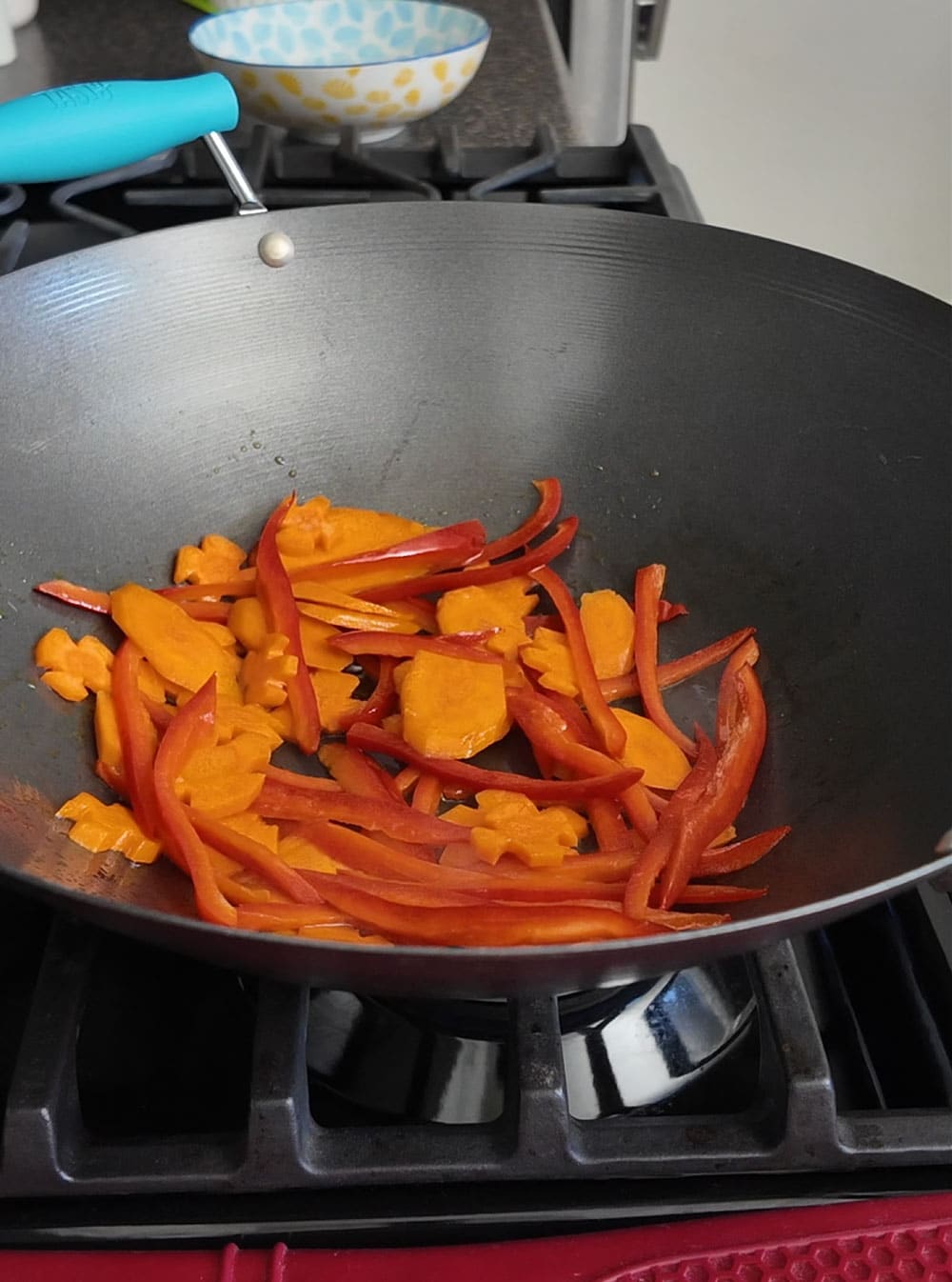 Add oil and butter to a large wok or skillet over medium/high heat. Once itโs hot, sautรฉ the carrots and red peppers to your desired doneness, stirring frequently. Remove from the skillet and set aside. Add-oil-and-butter-to-a-large-wok-or-skillet-over-medium-high-heat.-Once-hot,-saute-the-carrots-and-red-peppers-to-your-desired-doneness,-stirring-frequently