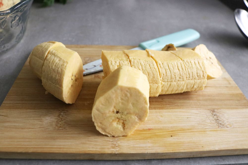 After-the-plantains-are-peeled,-cut-them-into-chunks-and-set-aside. After-the-plantains-are-peeled,-cut-them-into-chunks-and-set-aside.