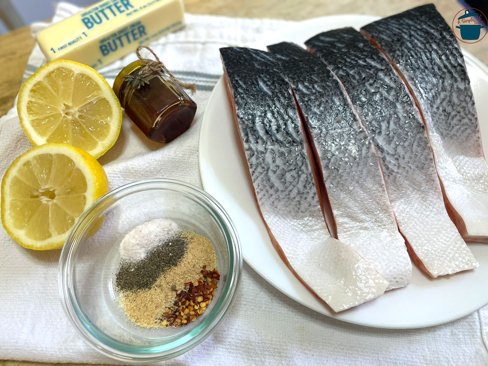I seasoned the fillets with garlic powder, Himalayan salt, and black pepper, and for a nice spicy kick red pepper flakes (optional) but highly recommended. And three of my favorite ingredients when making salmon, are lemon, unsalted butter, and honey. Wild-Salmon-Recipe