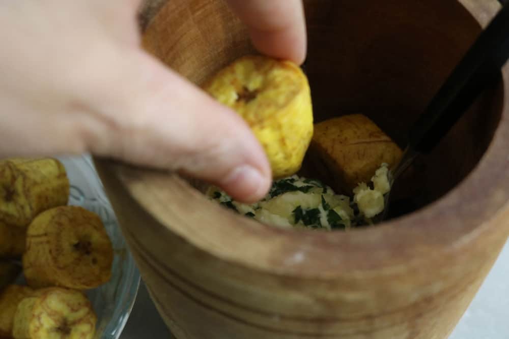 in-a-large-bowl-or-your-mortar-and-pestle-Add-the-fried-plantain-slices-and-some-of-the-butter-mixture-and-mash-them-in, in-a-large-bowl-or-your-mortar-and-pestle-Add-the-fried-plantain-slices-and-some-of-the-butter-mixture-and-mash-them-in,