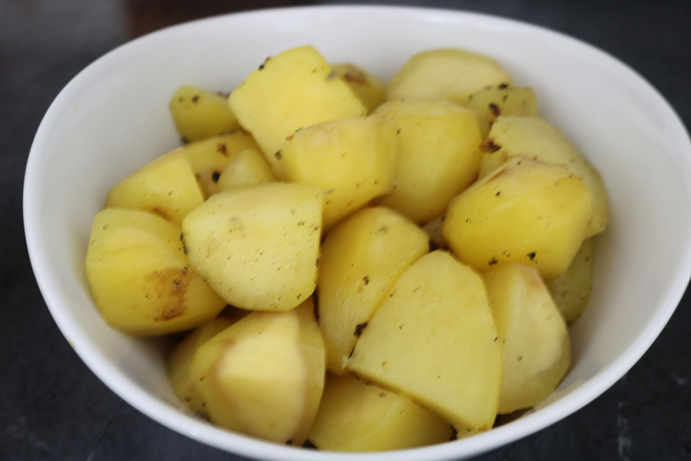 Remove-the-potatoes-from-the-pan-into-a-separate-bowl-and-set-aside. Remove-the-potatoes-from-the-pan-into-a-separate-bowl-and-set-aside.