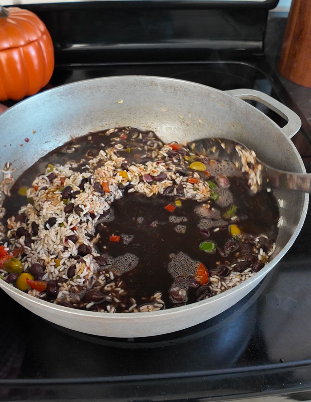 stir-until-all-ingredients-are-well-incorporated.-Right-after,-add-the-water-and-stir-again. Add-the-beans-and-the-rinsed-rice-and-stir-until-all-ingredients-are-well-incorporated.-Right-after,-add-the-water-and-stir-again.