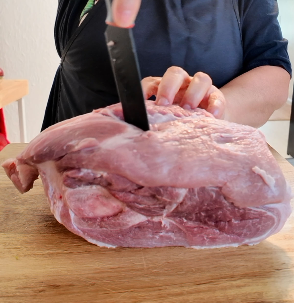 Make small slits all over the pork using a sharp knife to allow the seasoning to soak in. Use-a-sharp-knife-to-make-slits-all-over-the-meat.