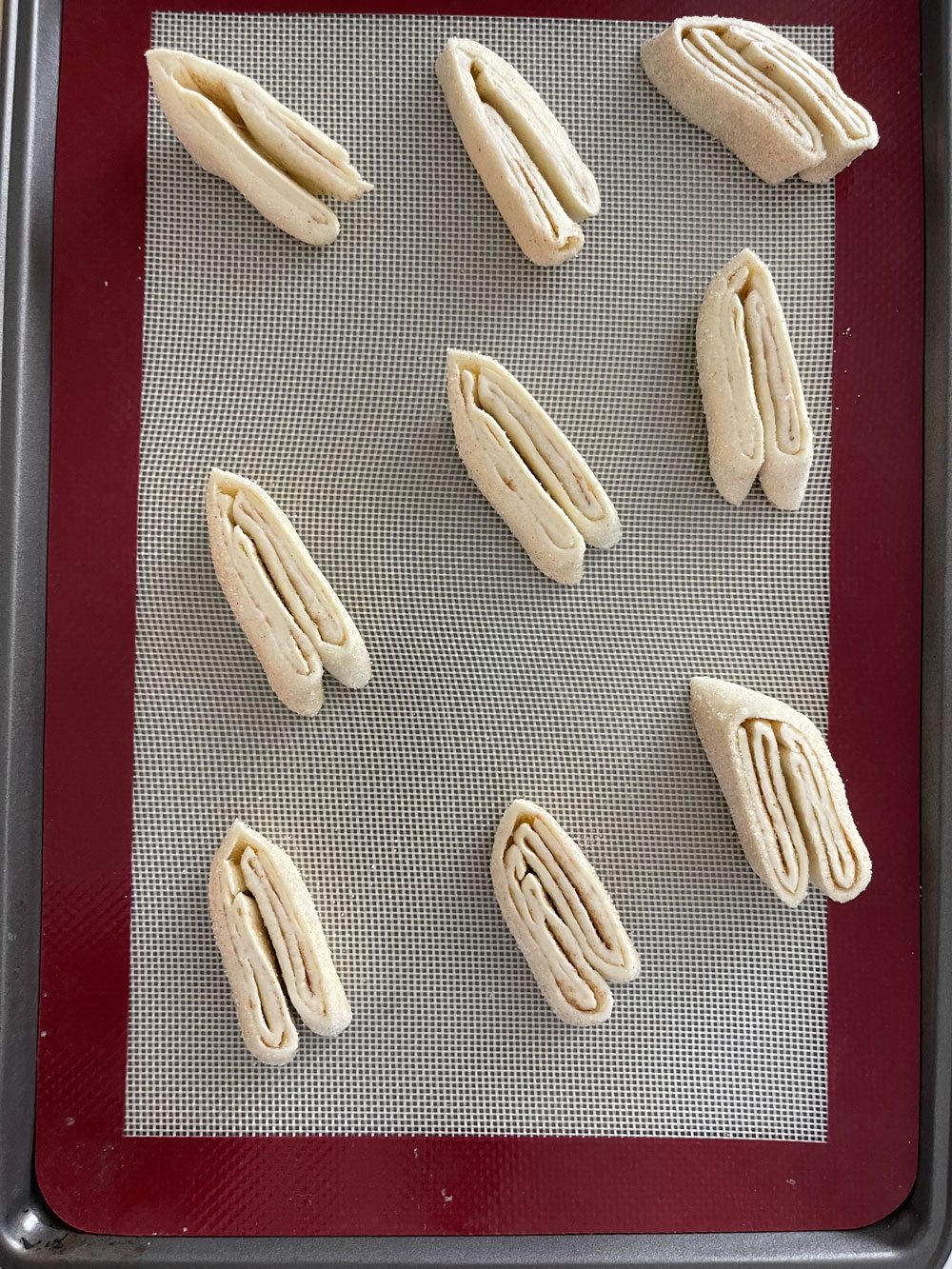 Bake the palmiers for 10-12 minutes until golden brown. Then, use a metal spatula to flip the cookies carefully and bake for another 2 minutes. Palmier-Recipe